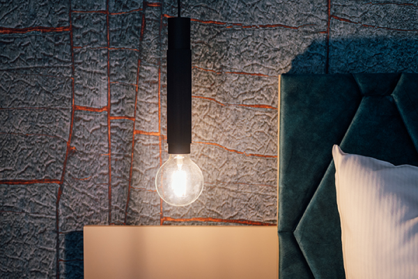 Galeriebild VEMA_3450.jpg Eine hängende Lampe über einem Nachttisch neben einem gepolsterten Kopfteil.